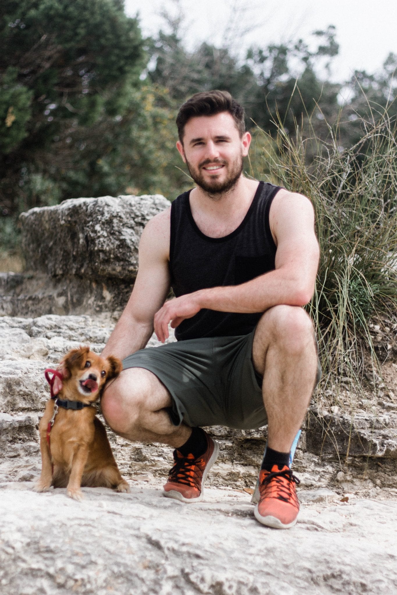 Man and small dog on Mt. Bonnell in Austin Texas